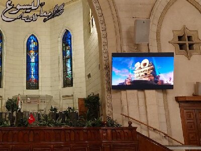The Screen Of Fabulux Lit Up In The Church